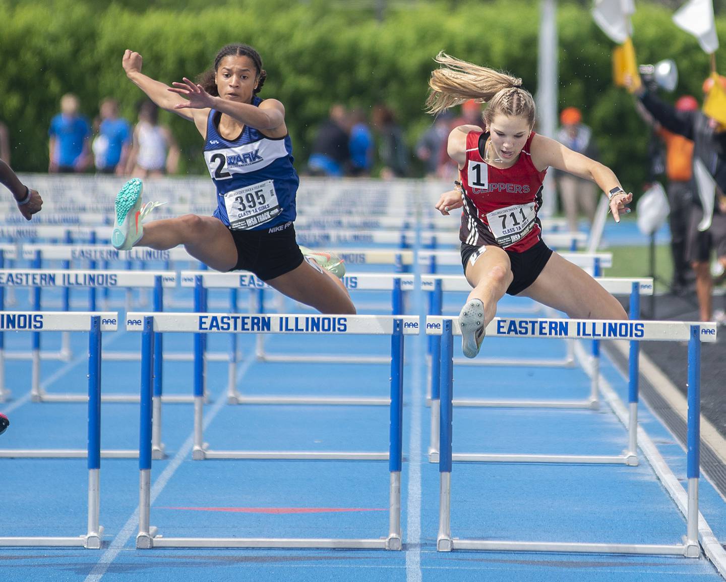 Amboy's Elly Jones (right) battles Newarks Kiara Wesseh in the 1A 100 hurdle finals during the IHSA girls state championships, Saturday, May 21, 2022 in Charleston.