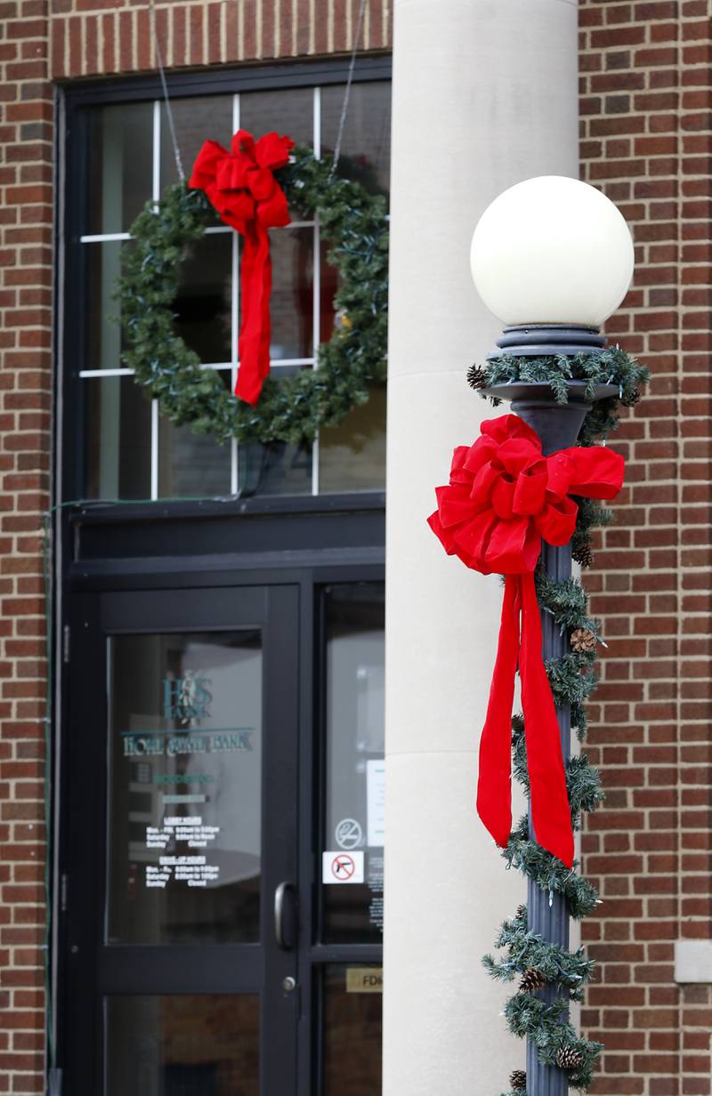 A wreath and garland outside the Home State Bank building on Tuesday, Nov. 12, 2024, in Woodstock.