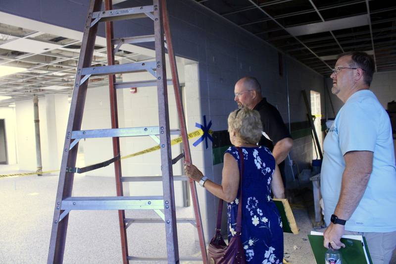 Rock Falls High School Superintendent Ron McCord, standing near the kitchen access, discusses improvements to the facility during a tour Wednesday that included board of education members Jan McKanna and Matthew Lillpop.