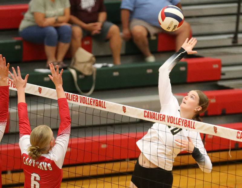 Sycamore's Ava Wente-Argo sends a kill past L-P's Maggie Boudreau on Tuesday, Sept. 23, 2025 in Sellett Gymnasium at L-P High School.