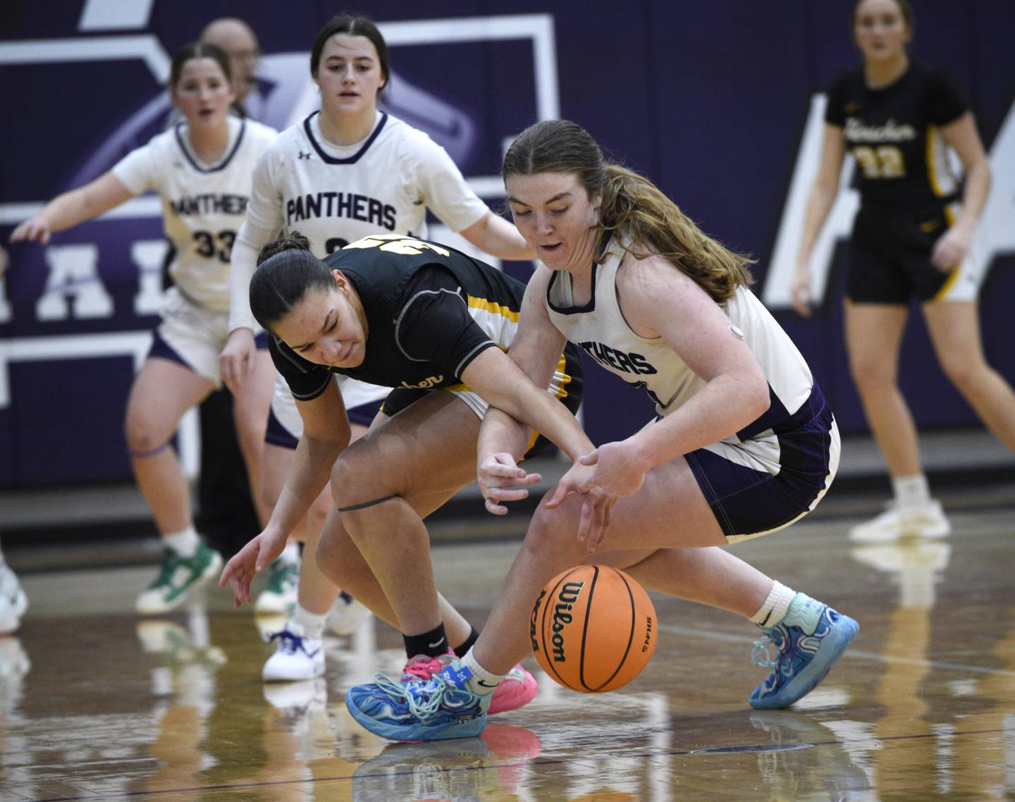 Manteno's Emily Horath, right, and Herscher's Leia Haubner, left, scramble for a loose ball in a game in Manteno on Thursday, January 15, 2026.