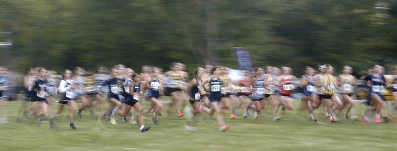 Girls Cross Country runners begin their race in a blur of motion. Sterling hosted their Cross Country final at Hoover Park on Saturday, October 25, 2025.