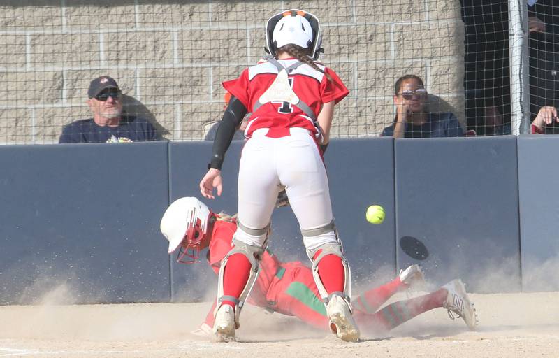 L-P's Karmen Piano steals home as the ball gets away from Streator catcher Morgan Kostal during the Class 3A Regional semifinal game on Tuesday, May 27, 2025 at Pontiac High School.