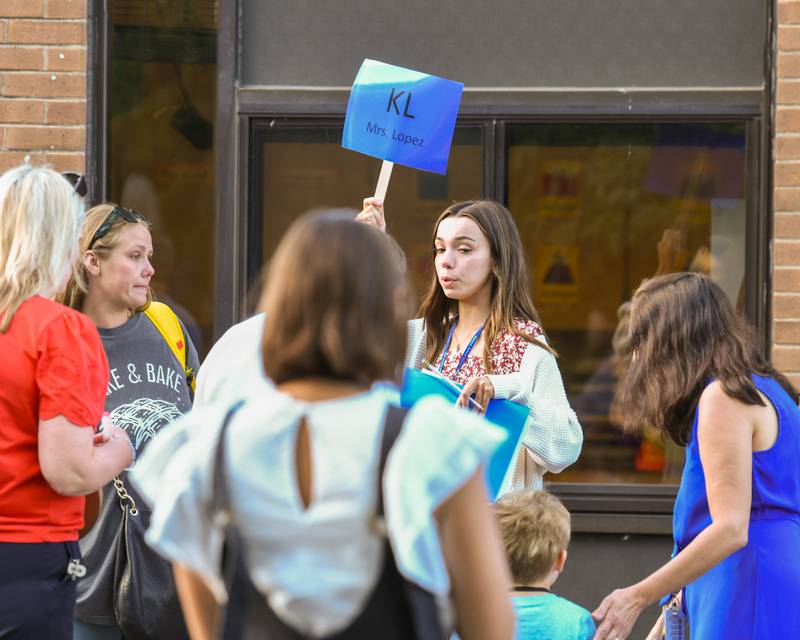 Mikayla Rawls helps parents and students get to the right place during the first day of class at Western Avenue Elementary school held on Thursday Aug. 21, 2025, in Geneva.