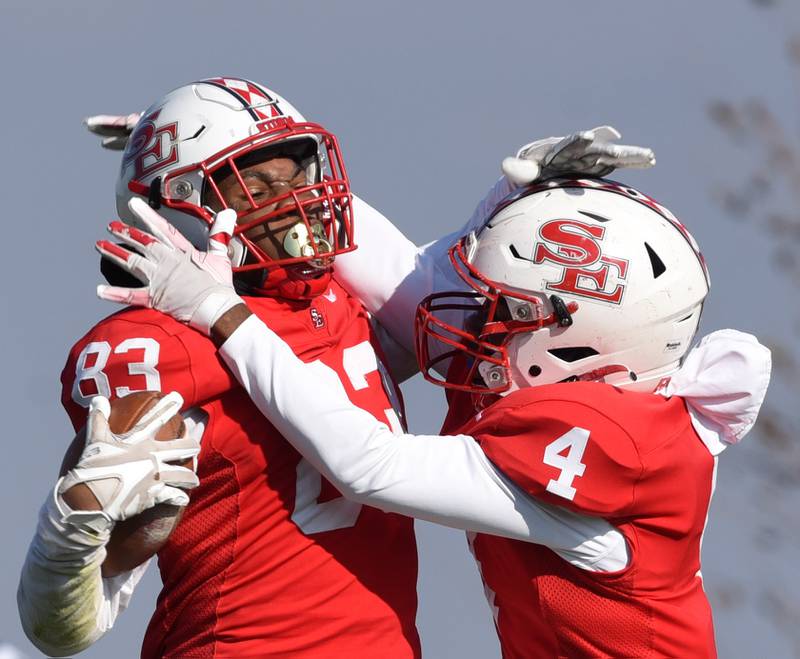 Joe Lewnard/jlewnard@dailyherald.com
South Elgin’s Ishmael George, left, celebrates a touchdown with teammate Kyle Corbin during the Class 8A second-round football game against Warren Saturday.