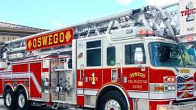 Car fire damages nearby building in Oswego