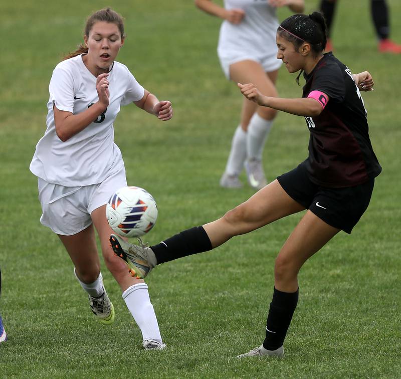 Prairie Ridge's Marissa Lemus kicks the ball toward the goal as Crystal Lake South's Allison Ray defends during a Class 2A Crystal Lake Central Regional girls soccer semifinal match on Tuesday, May 19, 2026, at Crystal Lake Central High School.