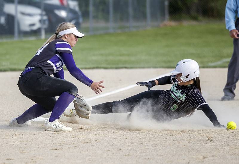 Rock Falls’ Julia Renner slides in safe at third base against Dixon Thursday, May 7, 2026.