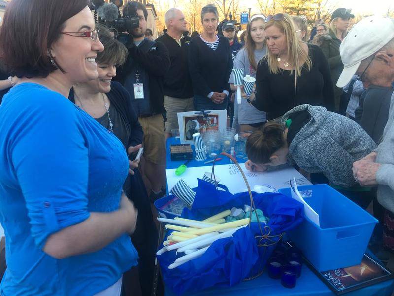 Residents gather at Main Beach in Crystal Lake to participate in a vigil for 5-year-old Andrew "AJ" Freund, who has been missing since Thursday.