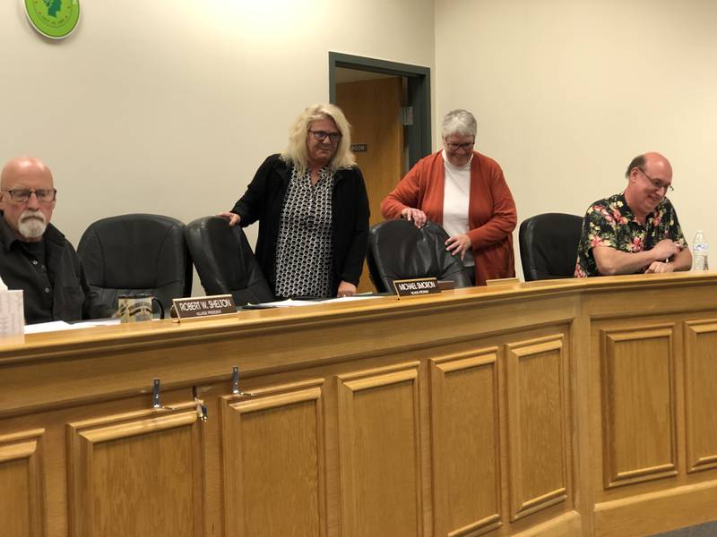Dawn Milarski, left, and Shirlee Correll take their seats on the Hebron Village Board on Monday, Sept. 26, 2022.