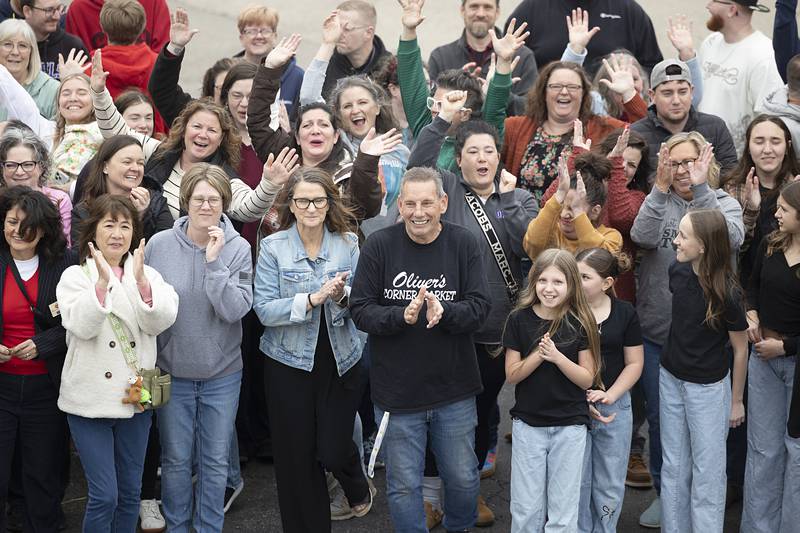 Patty and Tim Oliver (middle) celebrate Saturday, April 4, 2026, with friends, family and employees outside of Oliver’s Corner Market in Dixon.