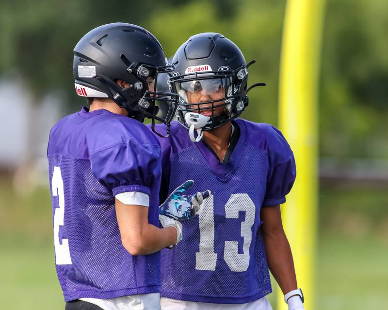 Amari Bryant (R) has a conversation with Kaiden Schimandle during Plano High School football practice. Aug 20 2024.
