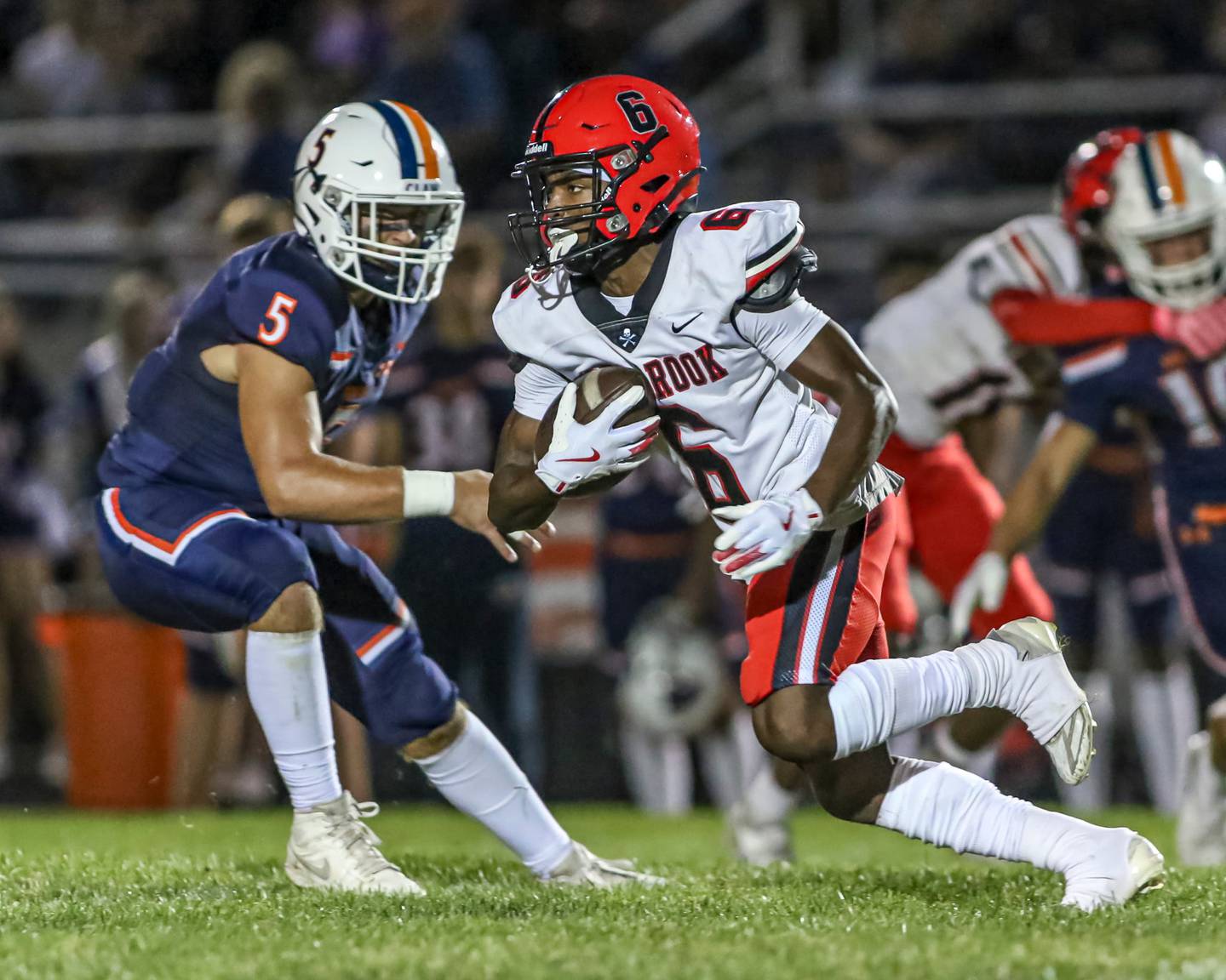 Oswego's Cam Loghman (5) defends Bolingbrook's Caleb Wallace during a game this season.