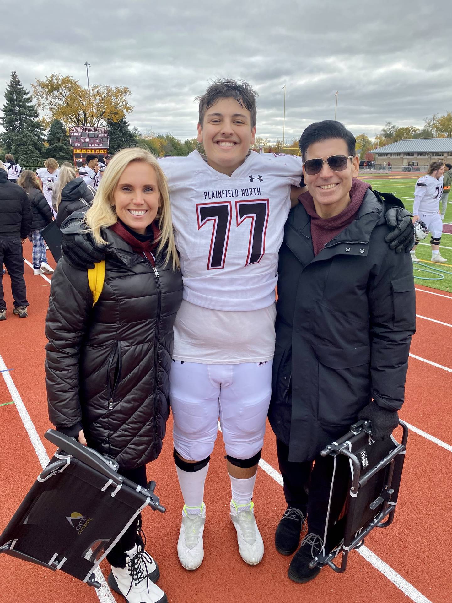 Plainfield North's Dominic Fasano (center) with his parents.