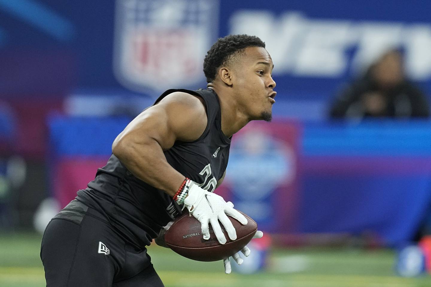 Kentucky wide receiver Wan'Dale Robinson runs a drill during the NFL scouting combine, Thursday, March 3, 2022, in Indianapolis.