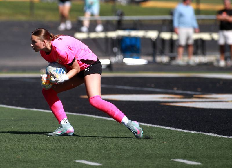 Wheaton Warrenville South goalkeeper Marilyn Dixon hangs onto the ball during a game against St. Charles East on Friday, May 16, 2025 in Wheaton.