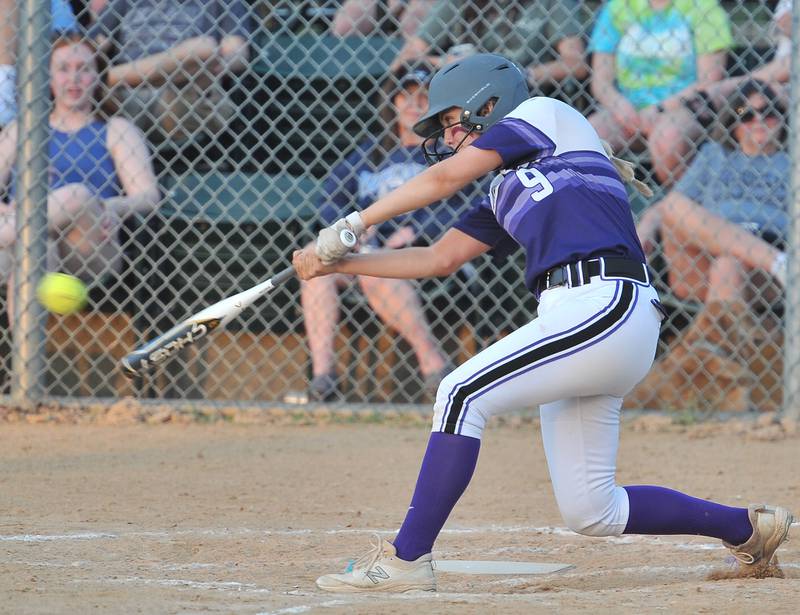 Downers Grove North's Avary Hodonicky smashes an RBI single during a game against Downers Grove South on May. 12, 2022 at McCollum Park in Downers Grove.