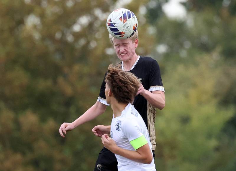 Sycamore's Paxton Nicol heads the ball over Kaneland's Noah McKittrick during their game Monday, Oct. 6, 2025, at Sycamore High School.