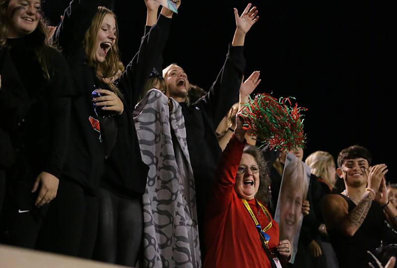 L-P fans root on the Cavaliers with science instructor Nancy Kochis on Friday, Sept. 30, 2022 at Howard Fellows Stadium in Peru.