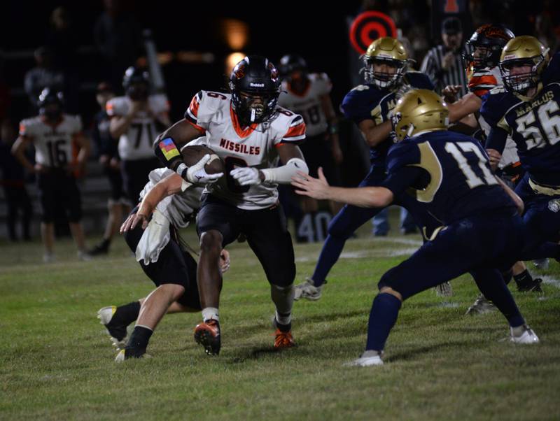 Milledgeville's Micah Toms-Smith (6) runs with the ball as Polo's Brock Soltow (17) looks to tackle him during Friday, Sept. 8, 2023 action at Polo High School.