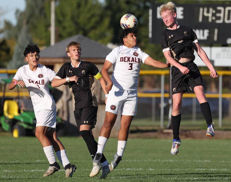 DeKalb's Mohammed Alkarzon heads the ball next to Sycamore's Paxton Nicol during the El Classicorn rivalry game Tuesday, Oct. 7, 2025, at Sycamore High School.