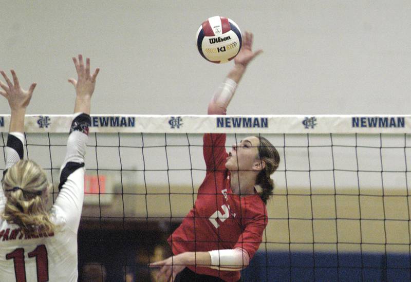 Oregon's Grace Tremble hits a ball past E-P's  Lauren Abbott. Erie-Prophetstown took on Oregon in the Class 2A regional volleyball semifinal Tuesday, Oct. 29, 2024 at Newman High School.