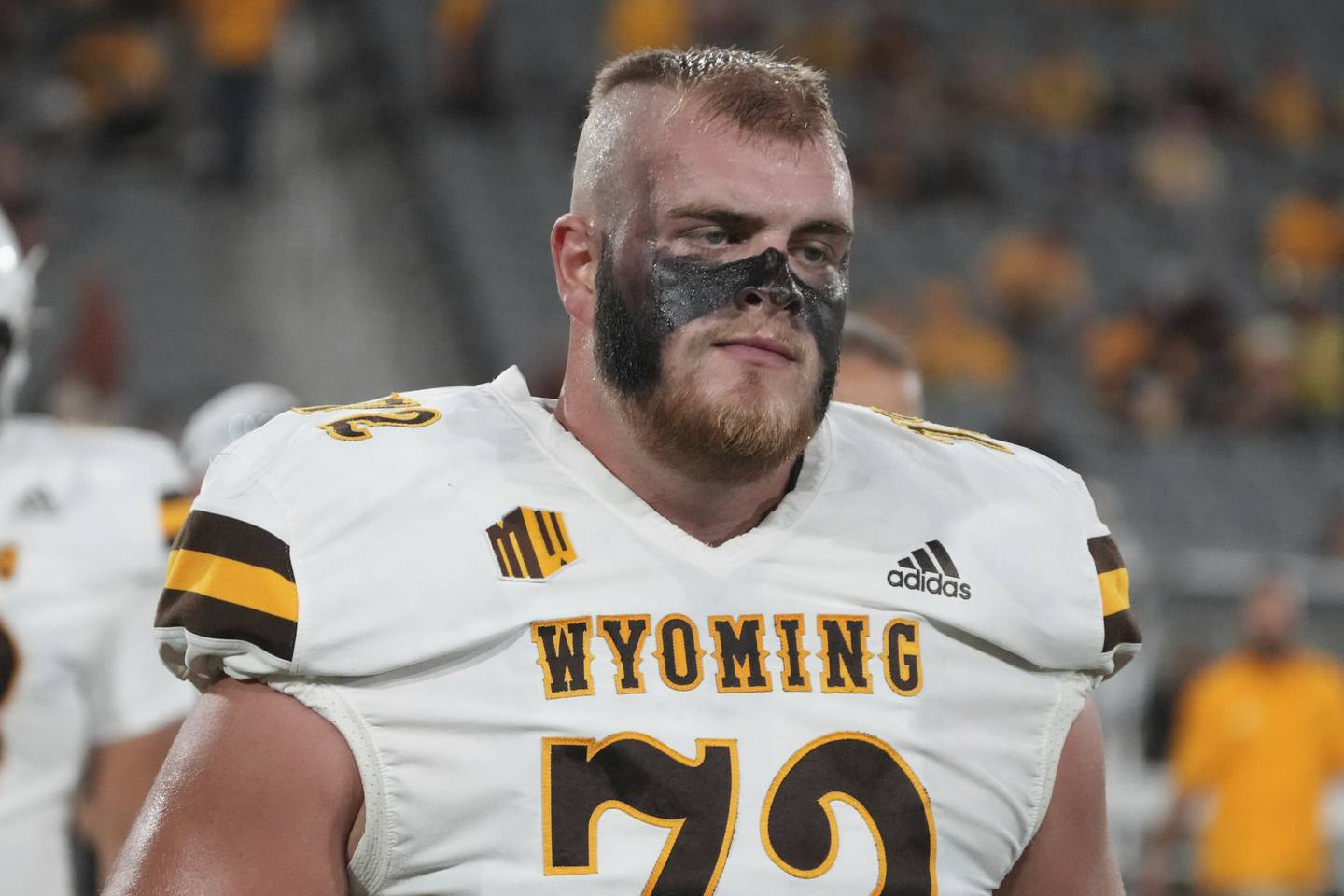 Wyoming offensive tackle Caden Barnett (72) warms up before an NCAA football game against Arizona State on Saturday, Aug. 31, 2024, in Tempe, Ariz. (AP Photo/Rick Scuteri)