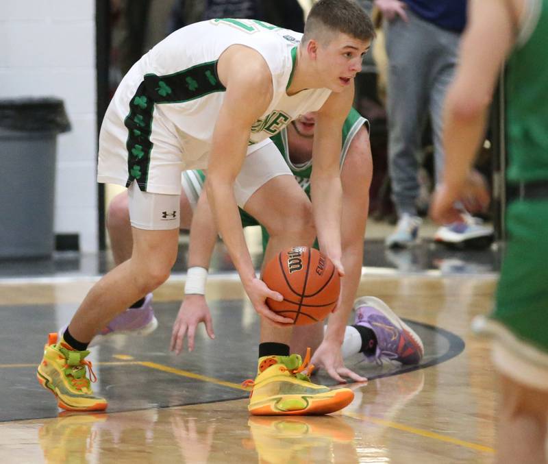 Seneca's Lane Provance picks up a loose ball against Dwight defenders during the Tri-County Conference Tournament on Wednesday, Jan. 25, 2023 at Putnam County High School.