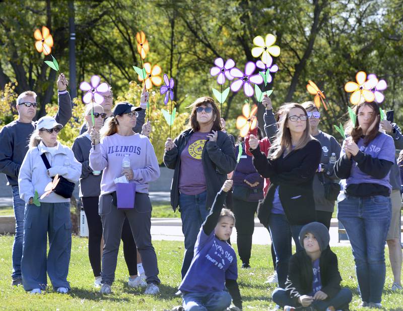Participants from Illinois Valley participating in the 2025 Walk to End Alzheimer’s on Saturday  in Ottawa, had the opportunity to take part in the Promise Garden ceremony, holding colored flowers that reflect their role or connection to Alzheimer’s.