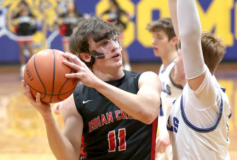 Indian Creek's Jeffrey Probst goes to the basket against Hinckley-Big Rock's Keegan Fitzpatrick during their game Tuesday, Jan. 31, 2023, in the Little 10 Conference Basketball Tournament at Somonauk High School.