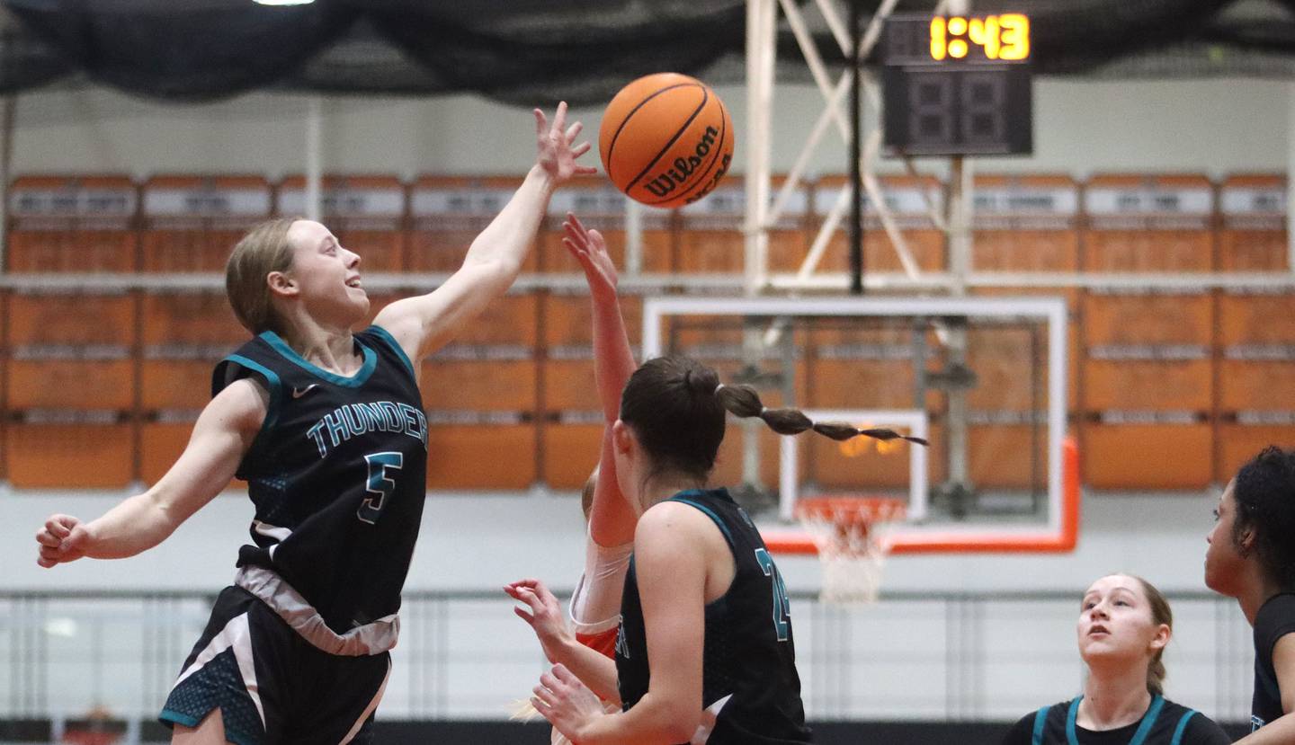 Woodstock North’s Allyson Schaid, left, battles for a rebound in varsity girls basketball on Monday, Jan. 26, 2026, at Crystal Lake Central High School in Crystal Lake.
