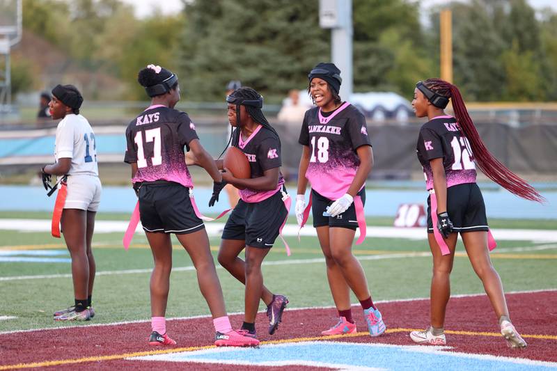Kankakee players celebrate a touchdown Taniyah Sherman, center, during the Kays' 40-26 victory over Plainfield South on Monday, Oct. 6, 2025.