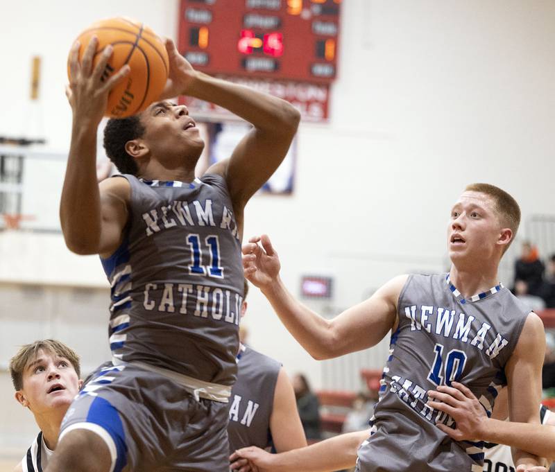 Newman’s Tyson Williams puts up a shot against Byron Friday, Dec. 19, 2025, in the Forreston Holiday Tournament title game.
