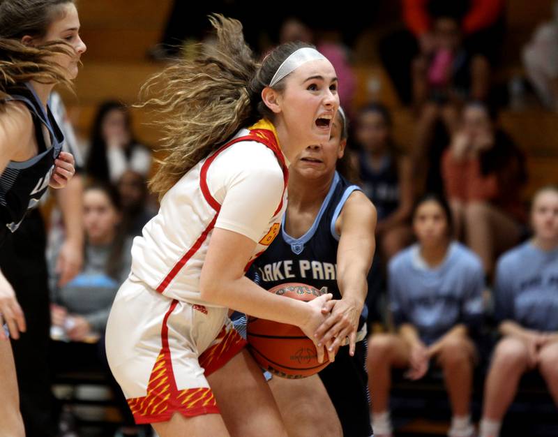 Batavia’s Alexa Schorr (center) holds onto the ball during a home game against Lake Park on Tuesday, Dec. 6, 2022.