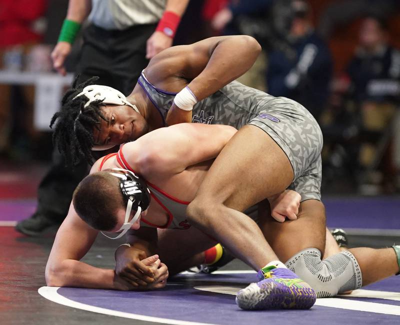 Plano’s Prince Amakiri (right) competes against Gibson City-Melvin Sibley’s Aiden Sancken in a 190 pound championship match during the Reaper Classic Wrestling meet at Plano High School on Saturday, Dec 9, 2023.