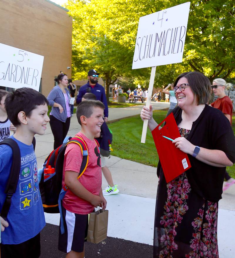 4th Grade teacher Kindra Schumacher welcomes her students to Kaneland John Shields Elementary School for the first day of the 2023-24 school year in Sugar Grove on Wednesday, Aug. 16, 2023.
