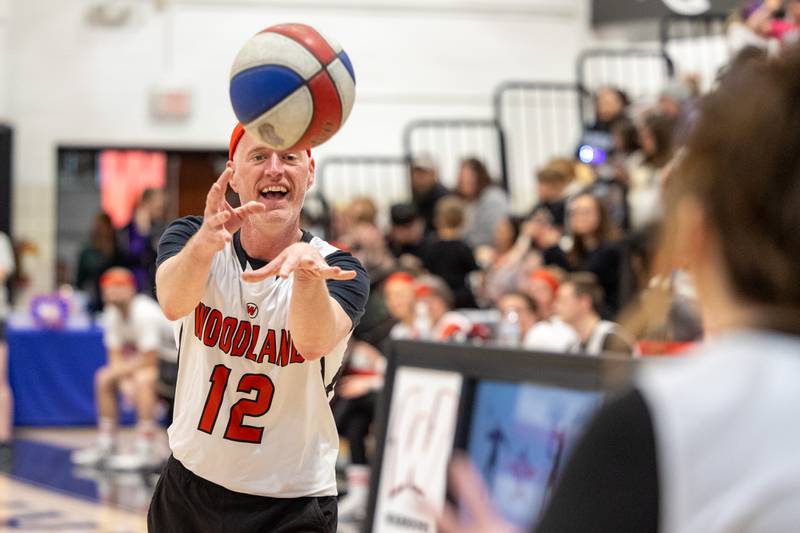 Coach Dumais (12) of Woodland High School passes ball to teammate on Wednesday, April 16, 2025 at Woodland High School in Streator.