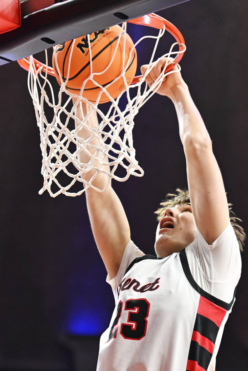 Benet Academy's Edvardas Stasys dunks against Evanston during the IHSA Class 4A boys basketball state semifinals at State Farm Center on Friday, March 14, 2025 in Champaign.