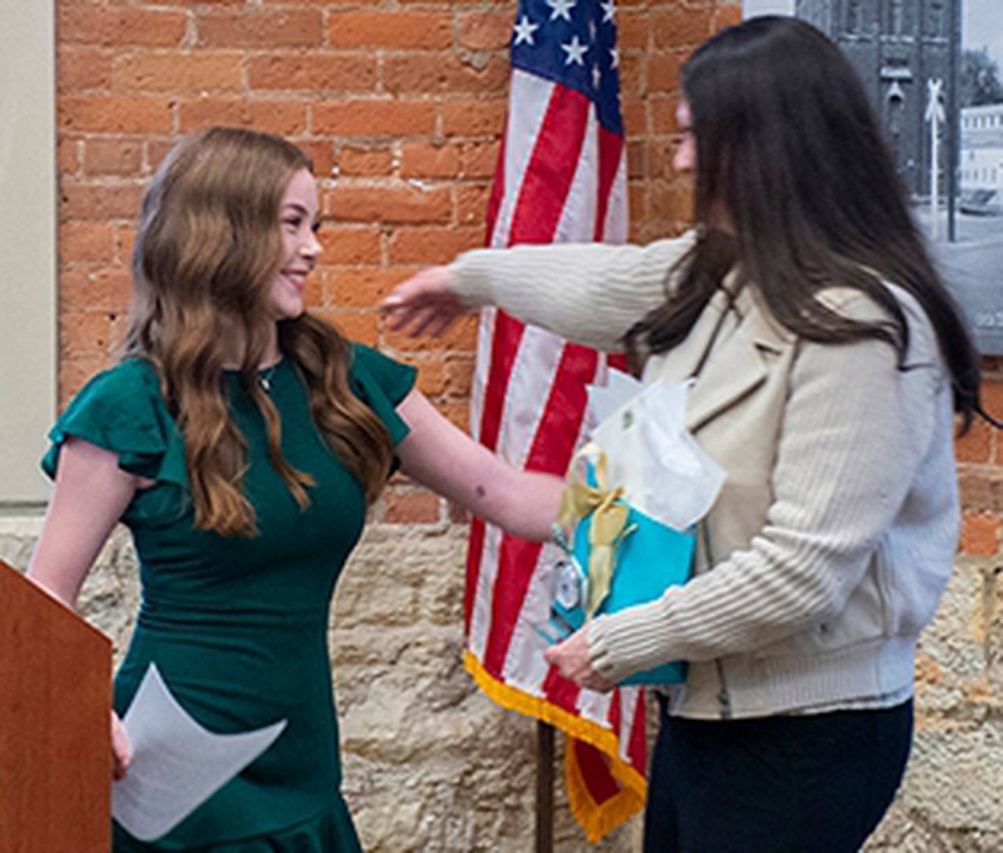 (Left to right); Sycamore High School student Anna Beetz recognizing Kristin Hill  during the 2025 Excellence in Education Awards ceremony