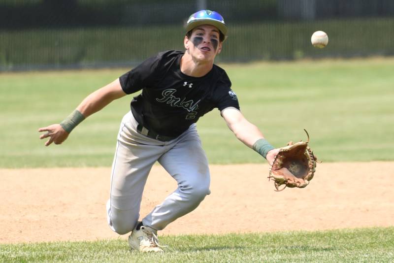 Bishop McNamara's Taylor Fuerst dives for a pop up during the Class 2A Beecher Sectional championship against Wilmington Saturday, May 31, 2025.