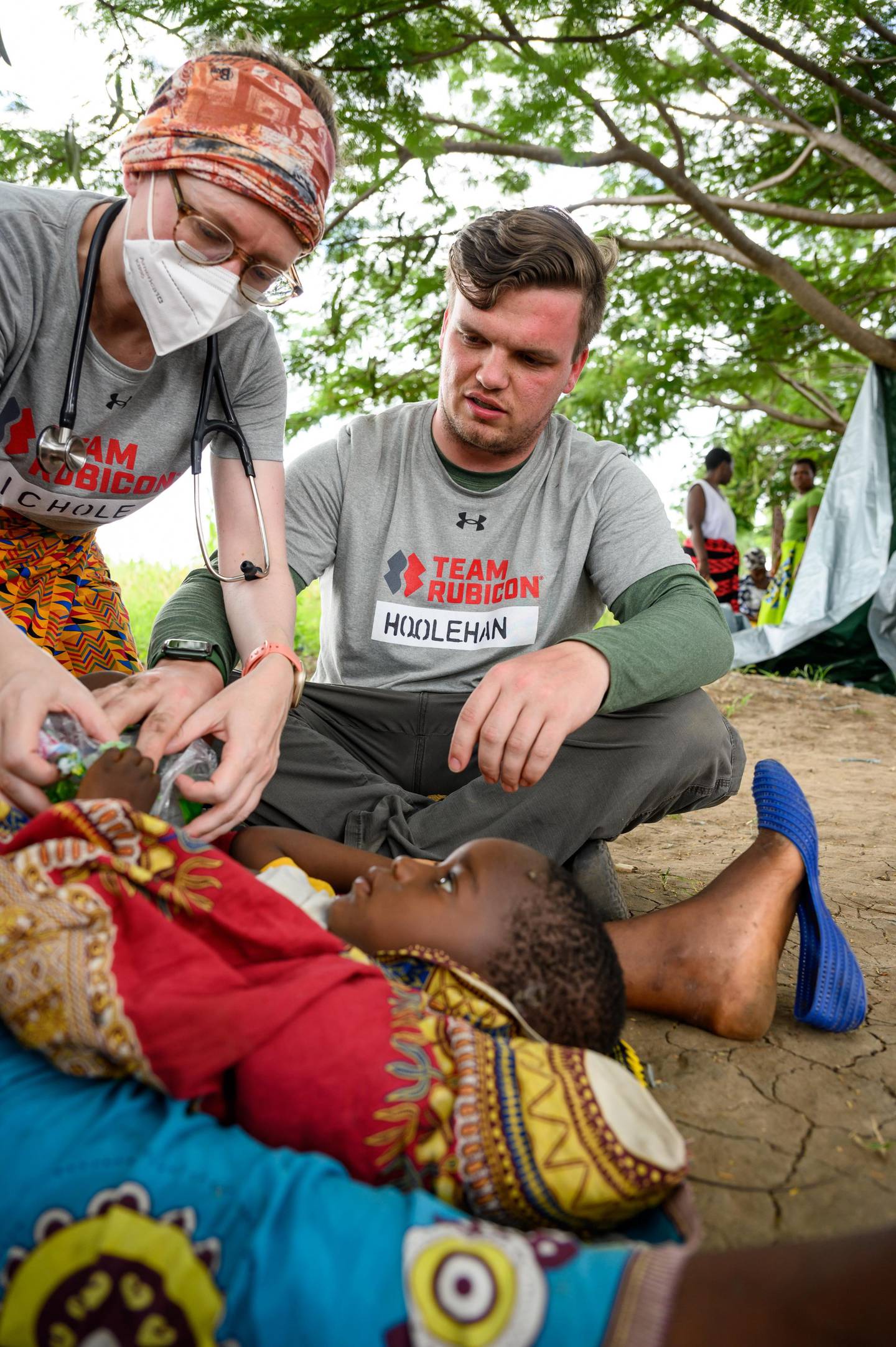 Branden Hoolehan (right), a paramedic with the Joliet Fire Department, recently delivered medical care to people in Malawi, Africa, in the aftermath of Cyclone Freddy, as a volunteer with Team Rubicon.