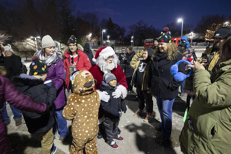 Santa stops to visit youngsters at the tree lighting for Dixon’s Christmas Walk Friday, Dec. 6, 2024.