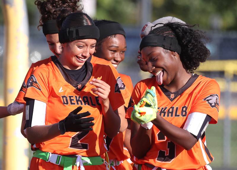 DeKalb players celebrate a touchdown Monday, Aug. 25, 2025, during their game against Belvidere at DeKalb High School. The contest marked the first ever game for the girls flag football program at DeKalb.