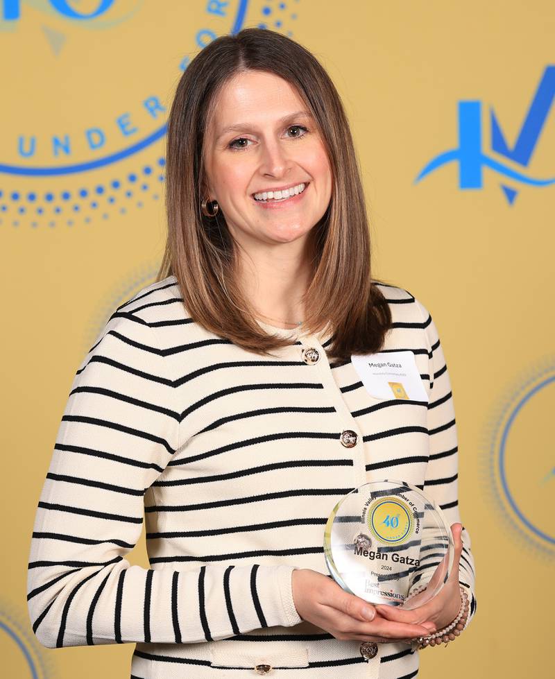 Megan Gatza poses with her 40 Under Forty award during the Illinois Valley Chamber of Commerce Champions of Change Awards Night on Thursday, April 10, 2025 at the Westclox Event Center in Peru.