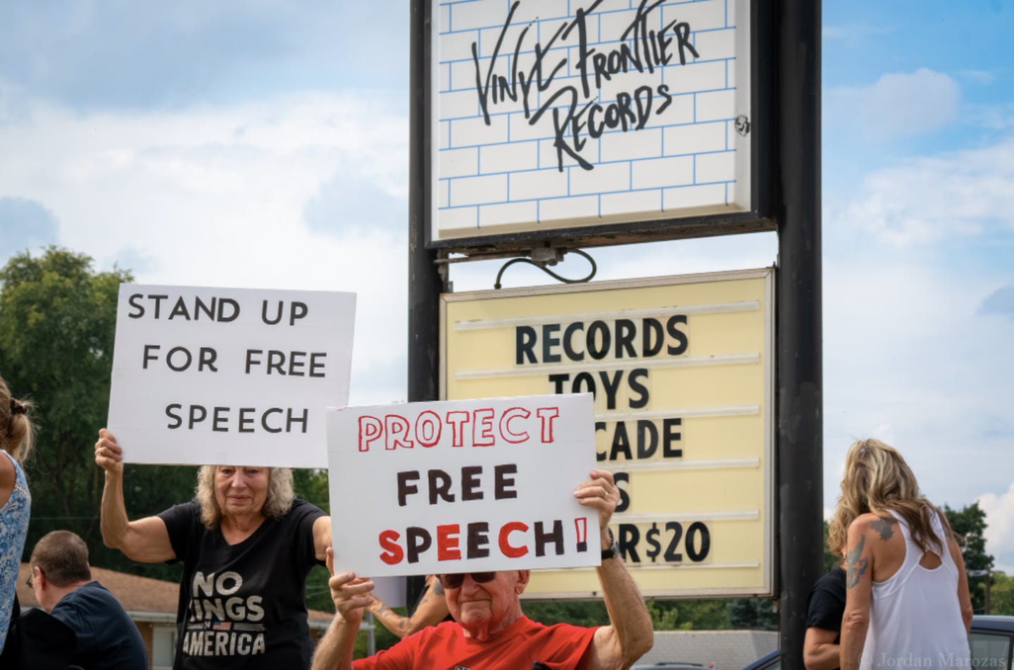 People protesting against comments made by Vinyl Frontier Records' owner over the assassination of Charlie Kirk along with people protesting free speech rights in McHenry on Sept. 20, 2025.