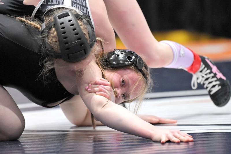 Glenbard East’s Nadiia Shymkiv holds her position against Saint Viator’s Charlotte Nold in the 105-pound class at the girls wrestling state finals tournament at Grossinger Arena in Bloomington on Saturday, Feb. 28, 2026.