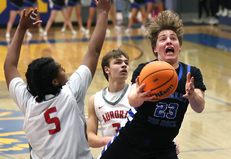 Hinckley-Big Rock's Luke Badal drives to the basket past Aurora Christian's Jordan Weeks during their sectional final game Friday, March 7, 2025, at Somonauk High School.