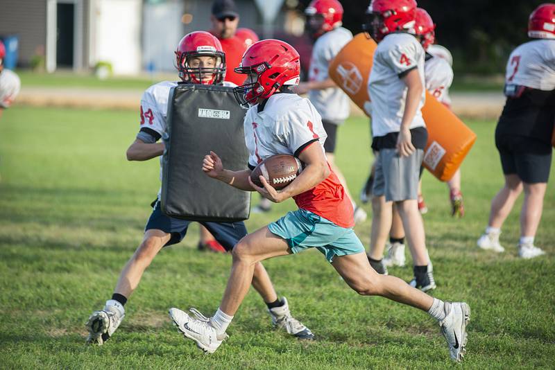 Amboy players run through drills Thursday, July 28, 2022 at the high school. First day of IHSA football practice is just over a week away for local teams.