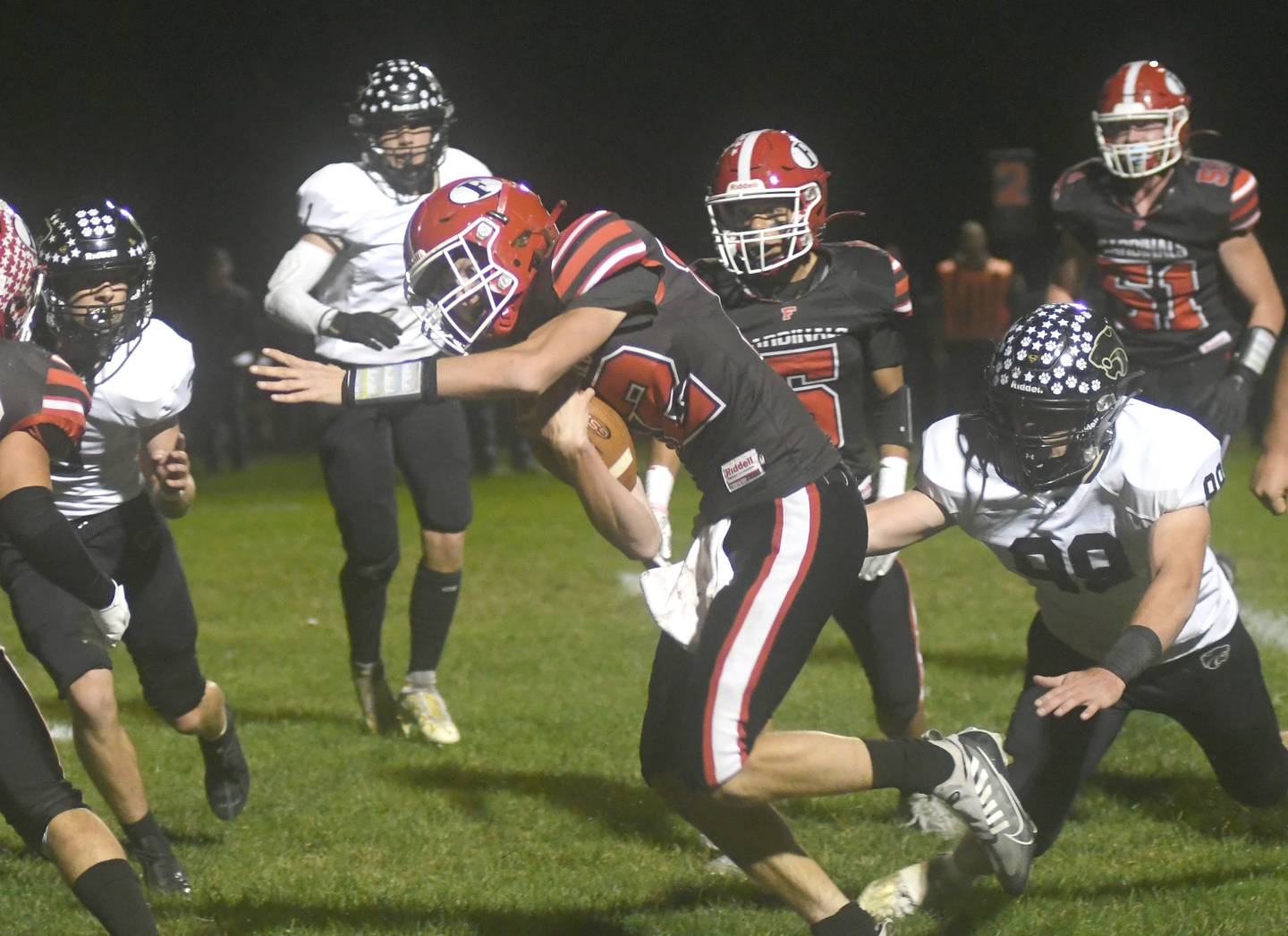 Forreston quarterback Brock Smith heads to the end zone in first quarter action against Lena-Winslow in a NUIC battle in Forreston on Friday, Oct. 21. The Cardinals scored first to lead 8-0, but the Panthers scored on the ensuing kick off and added another TD just before the end of the half to lead 14-8.