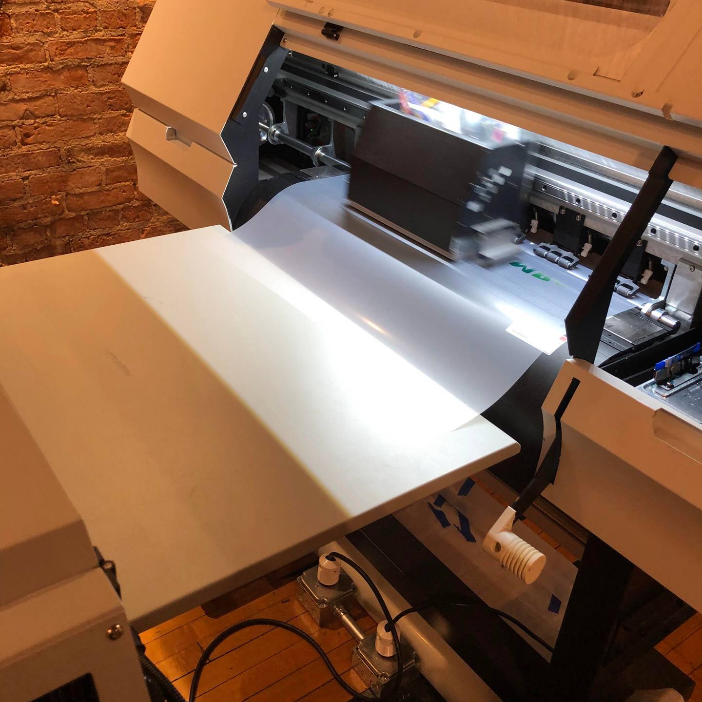 The direct to film printing machine creates a new custom design Thursday, March 9, 2023 at PersonaliTees in downtown Ottawa.